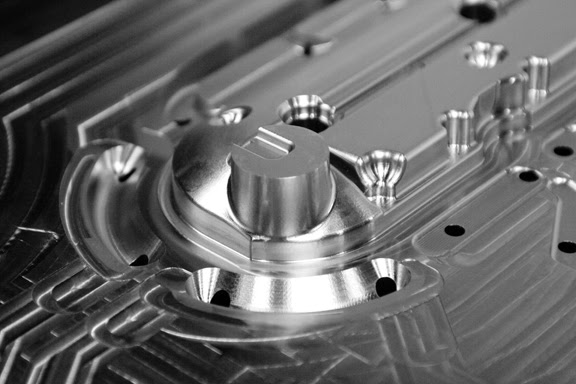 Precision machined die casting component